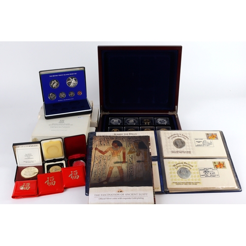 1042 - World silver commemorative coins and medals, and sets with silver content. A crate of material. Need... 