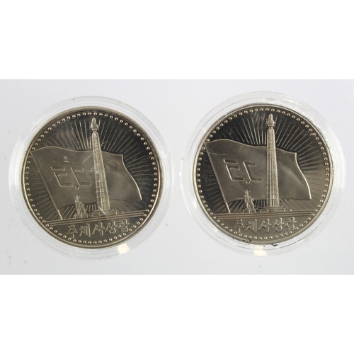 949 - North Korea (2) cupro-nickel 1 Won 1987, BU in capsules.