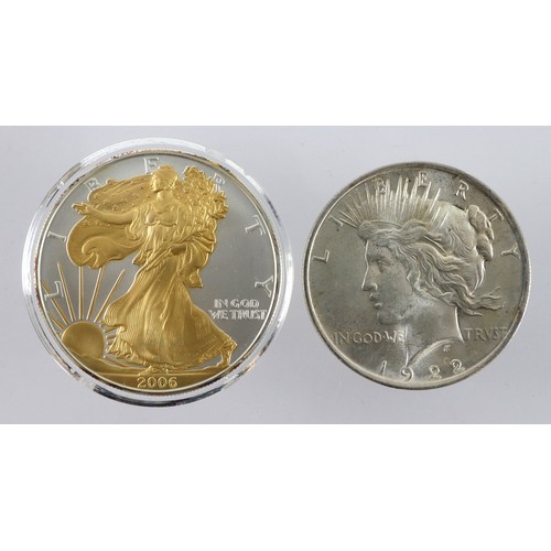 987 - USA Silver Dollars (2): Peace type 1922 UNC, and 1oz fine silver Eagle 2006 with selective gilding, ... 