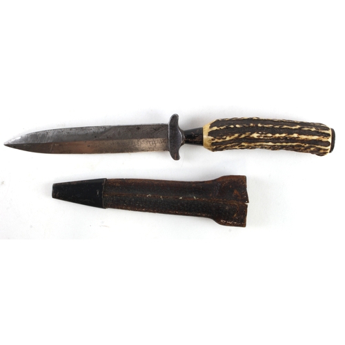 61 - Knife: An outstanding German WW1 officer's fighting knife. Double edged blade signed 