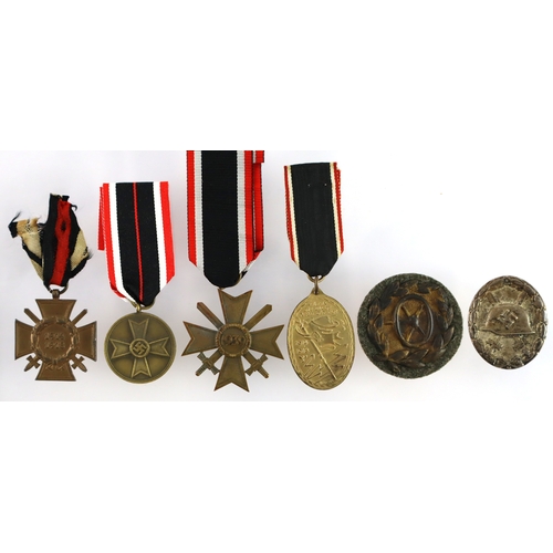 712 - German Badges and medals including War merit medal, War Merit cross, Cross of Honour, wound badge in... 