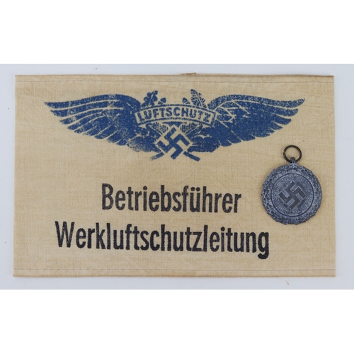 779 - German Luftschutz Civil Defence medal with arm band.