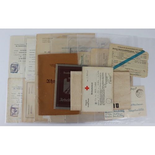 934 - German WW2 selection of documents, photos, arm band etc.