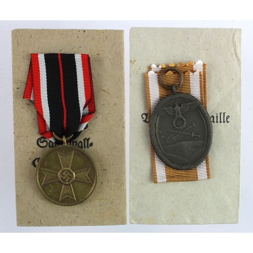 941 - German WW2 West Wall medal and War Merit medal both in packets of issue.