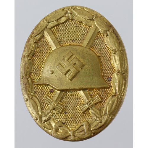 732 - German Gold wounds badge, maker L/63, solid.