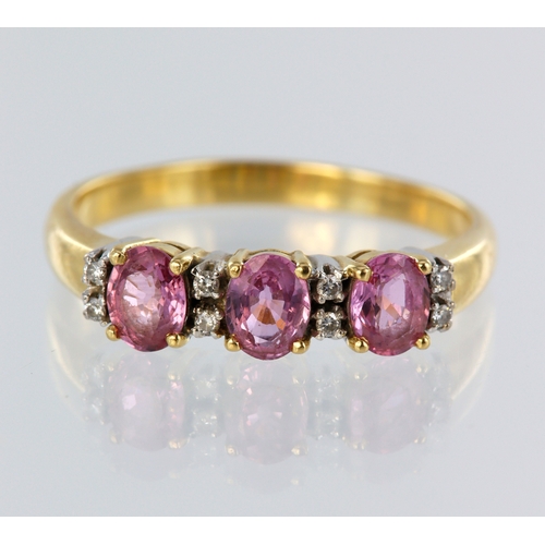 105 - Yellow metal (stamped 18ct) pink sapphire and diamond half eternity ring, three oval pink sapphires ... 