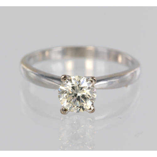 107 - White metal (stamped 18ct) diamond solitaire ring, single round brilliant cut weighing approx. 0.92c... 