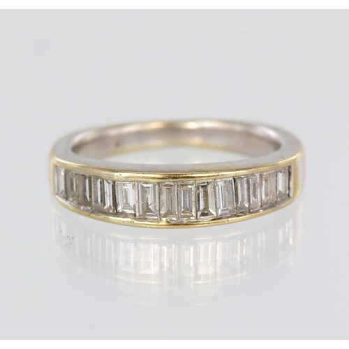 108 - Yellow metal (tests18ct) diamond half eternity channel set ring, fifteen baguette cuts, total diamon... 