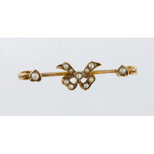 480 - Yellow metal (tests 9ct) bow brooch set with seed pearls, length 30mm, weight 1.1g