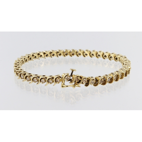 481 - Yellow metal (tests 14ct) diamond line bracelet with box clasp and safety catch, fourty three round ... 