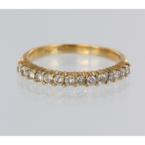 62 - Yellow metal (stamped 18ct) diamond half eternity ring, fourteen round brilliant cuts, total diamond... 