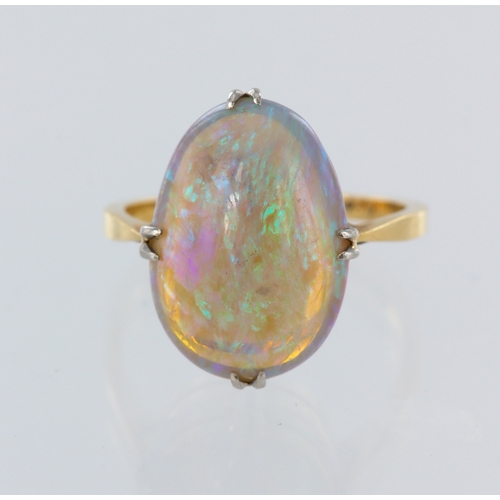 63 - 18ct yellow gold opal ring, single oval cabochon measuring approx. 16mm x 11mm, finger size L/M, wei... 