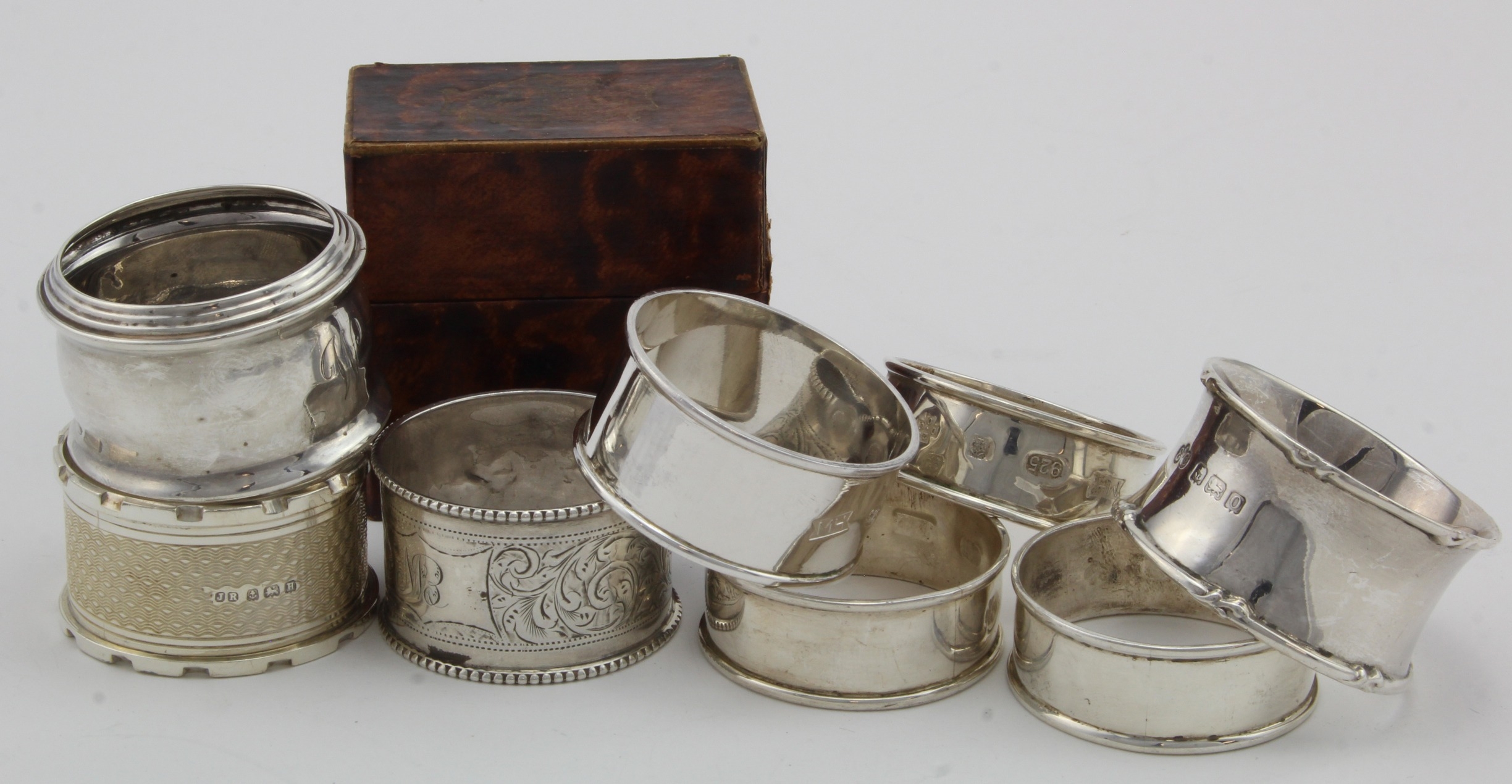 Eight silver napkin rings, four bear the 2000 hallmarks and four bear ...