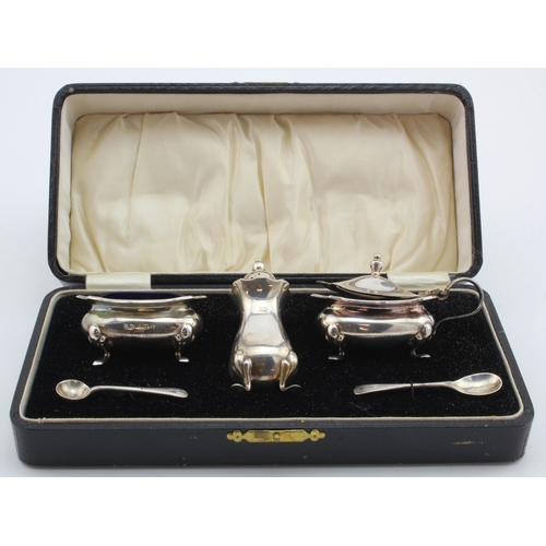 759 - Boxed three-piece silver cruet set, comprising salt, pepper and mustard pots; two silver condiment s... 