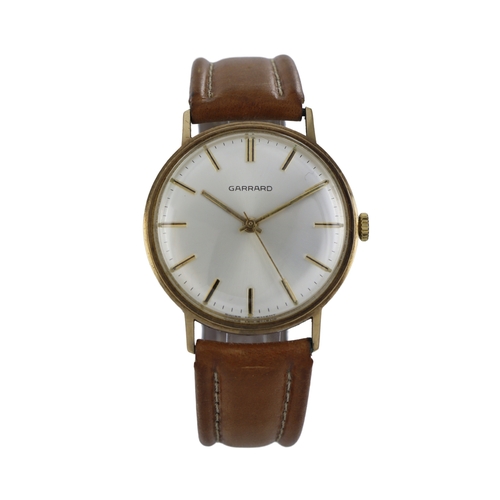 504 - Garrard 9ct gents manual wind wristwatch, circa 1983. The silvered dial with gilt baton markersand h... 