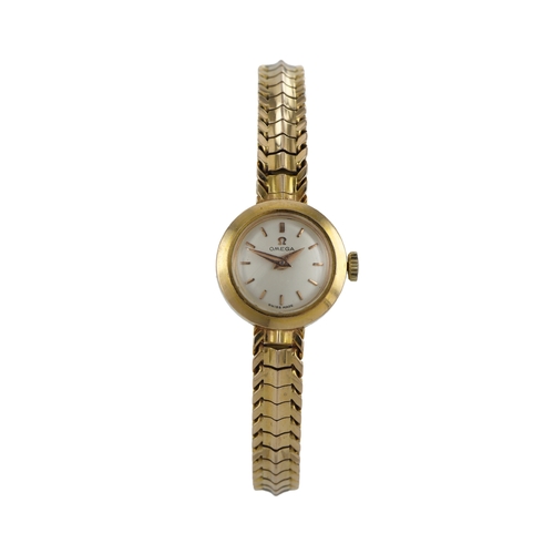 521 - Omega 18ct yellow gold ladies manual wind wristwatch, circa 1958. The silvered dial with baton marke... 