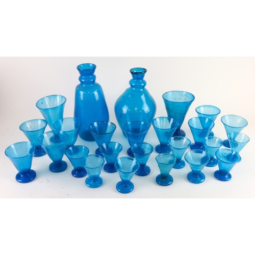 100 - Pompeian Bubble Glass. A blue hand blown pompeian bubble glass decanter, in the style of John Walsh,... 