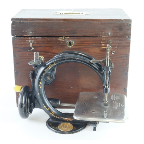 408 - Wilcox & Gibbs sewing machine, height 19cm, length 28.5cm approx., contained in a wooden box