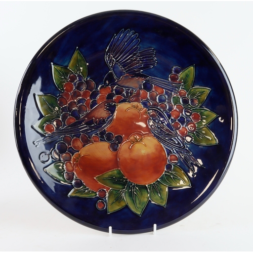 89 - Moorcroft Finches & Fruit pattern charger, makers marks to verse, diameter 35.5cm approx.