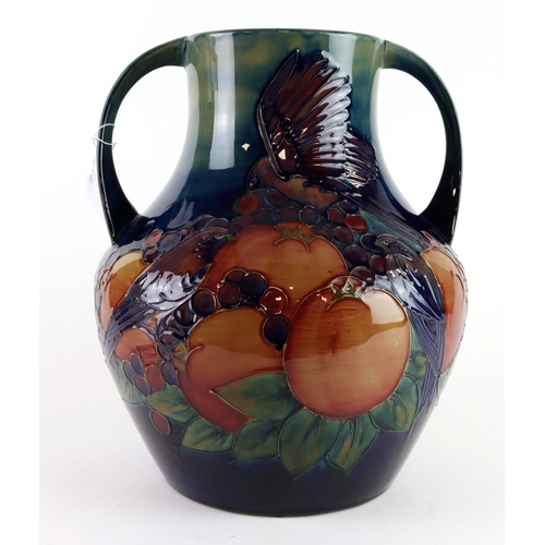 94 - Moorcroft. A large Moorcroft Finches & Fruit pattern twin handled vase, makers marks to base, height... 