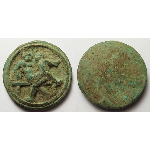 395 - Artefact: Roman bronze erotic applique d.38mm, 32.72g. Green patina, deposit, trace gilding. Sold as... 