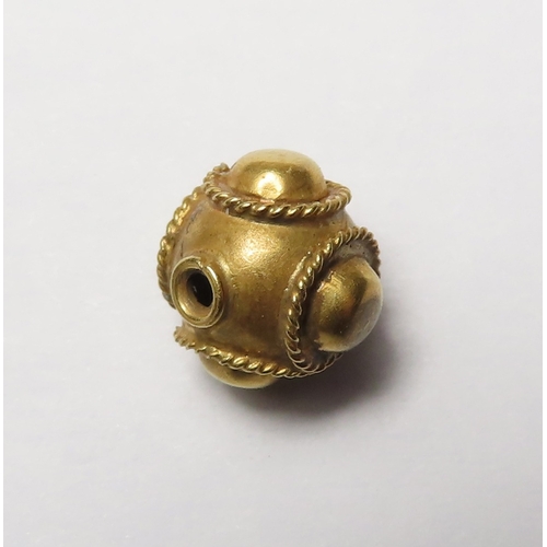 413 - Artefact: A gold bead 9.5mm, 0.85g, believed to be Anglo-Saxon but otherwise sold as seen.