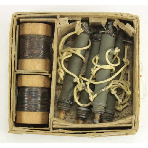 533 - WW2 scarce collection of four trip wire detonators in original box with two rolls of wire.