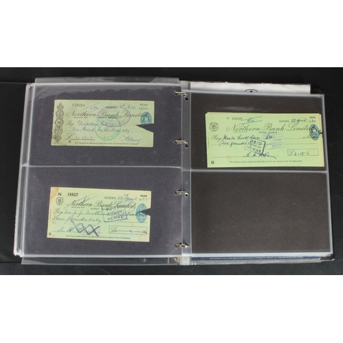 25 - Cheques (253), a collection of mainly Northern Bank of Ireland cheques in an album, date range 1930 ... 