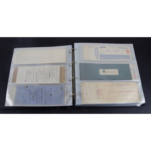 26 - Cheques (262+), a collection of large older cheques in album sorted into Countries of issue, the maj... 