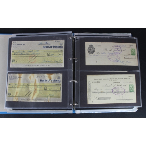 27 - Cheques (264), a collection of mainly Irish cheques in an album, the majority being Bank of Ireland ... 