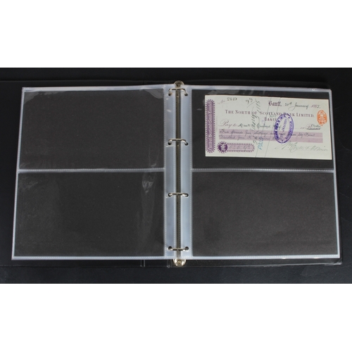 30 - Cheques (73), a collection of Scottish cheques in an album, comprising Aberdeen Town & County Bankin... 