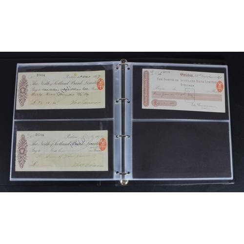 30 - Cheques (73), a collection of Scottish cheques in an album, comprising Aberdeen Town & County Bankin... 
