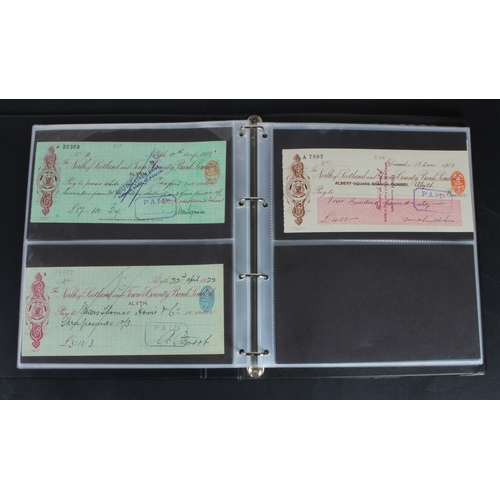 30 - Cheques (73), a collection of Scottish cheques in an album, comprising Aberdeen Town & County Bankin... 