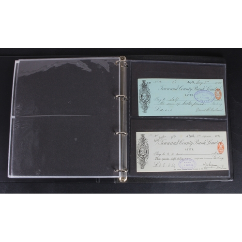 30 - Cheques (73), a collection of Scottish cheques in an album, comprising Aberdeen Town & County Bankin... 