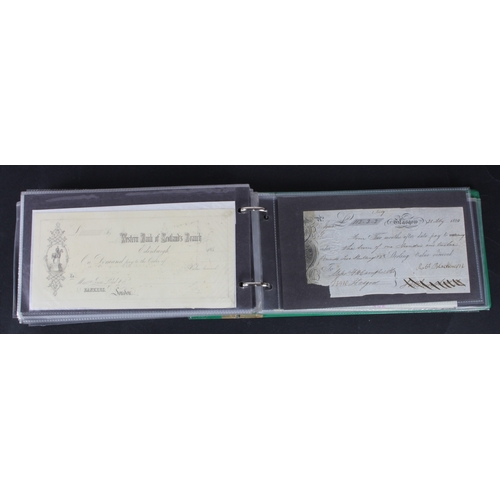 32 - Cheques and receipts (129), a collection of Scottish mainly cheques and receipts in an album, includ... 