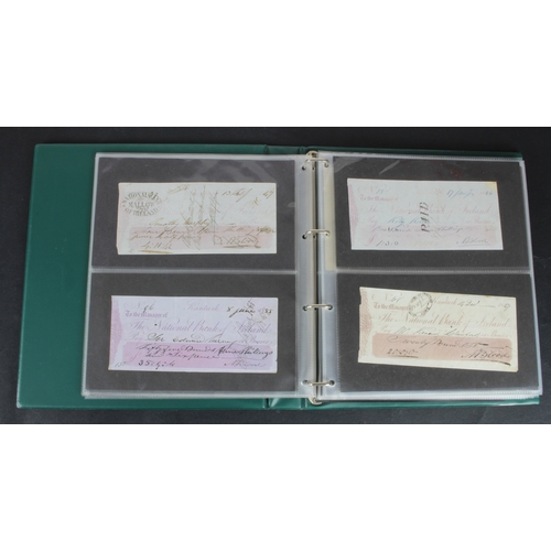 34 - Cheques and Travellers Cheques (107), an album of cheques from the 1800's, 40 British Banks and 50 F... 
