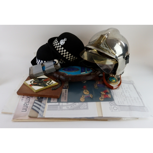 1054 - Box of mixed militaria including plaques, French Riot Helmet, cloth on board, certificates, 2x femal... 