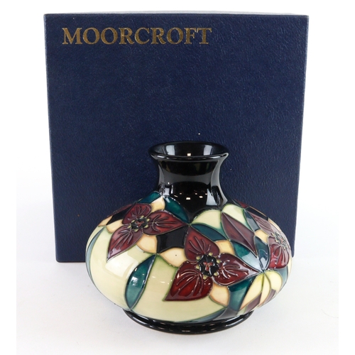 102 - Moorcroft 'Trillium' pattern squat vase, dated 2000, makers marks, height 10cm approx., contained in... 