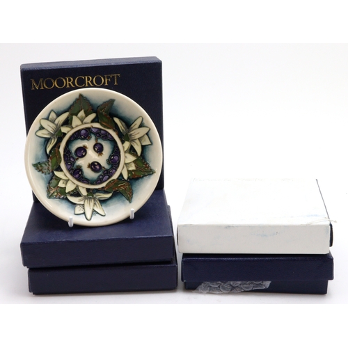 108 - Moorcroft. A collection of five boxed Moorcroft pin dishes, various patterns, diameter 12cm approx.