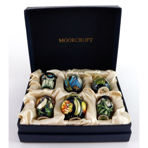 110 - Moorcroft. A collection of six Moorcroft miniature vases & ginger jar, makers marks to base of each,... 
