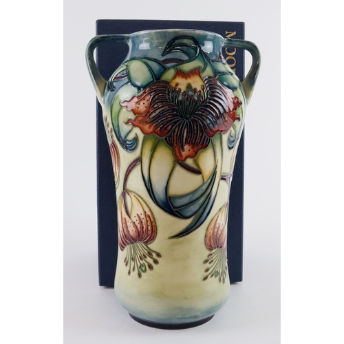 61 - Moorcroft 'Anna Lily' pattern twin handled vase, makers marks to base, height 25cm approx., containe... 