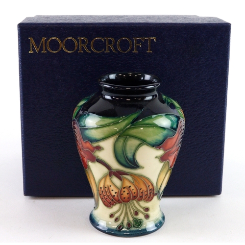 64 - Moorcroft 'Anna Lily' pattern vase, dated 1998, makers marks to base, height 9cm approx., contained ... 