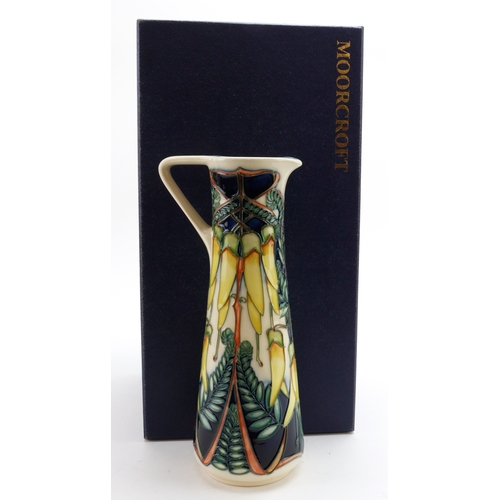 81 - Moorcroft 'Kowhai' pattern jug, dated 2003, makers marks to base, height 23cm approx., contained in ... 