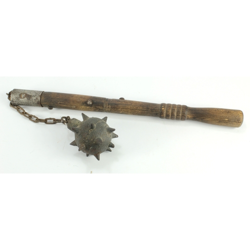 944 - WWI trench mace. Heavy spiked ball on chain attached to wodden grip. Interesting piece of some age.