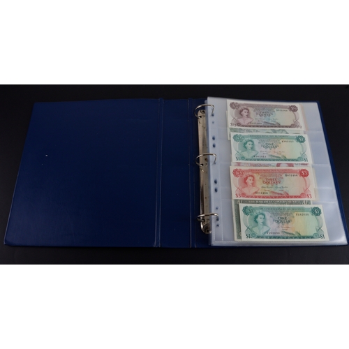 454 - British Commonwealth (90), a good group of Queen Elizabeth II portrait notes in an album, Bahamas (1... 