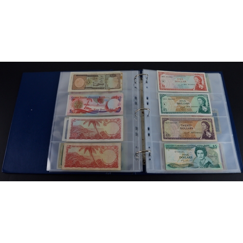 454 - British Commonwealth (90), a good group of Queen Elizabeth II portrait notes in an album, Bahamas (1... 