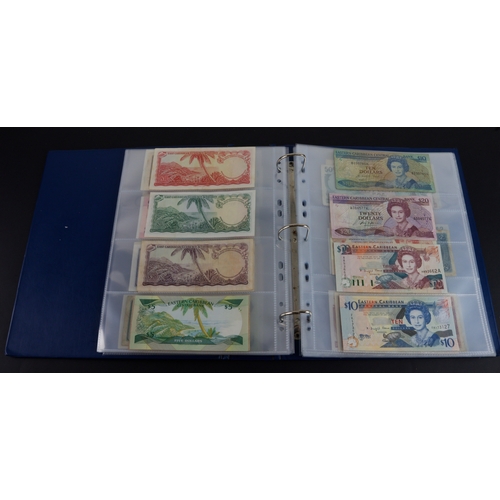 454 - British Commonwealth (90), a good group of Queen Elizabeth II portrait notes in an album, Bahamas (1... 