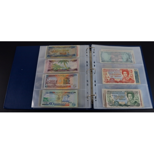 454 - British Commonwealth (90), a good group of Queen Elizabeth II portrait notes in an album, Bahamas (1... 