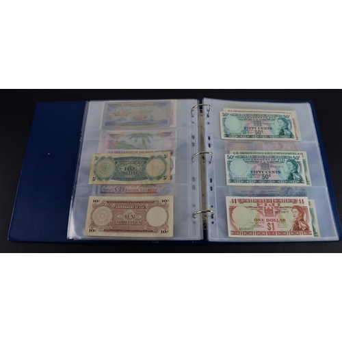 454 - British Commonwealth (90), a good group of Queen Elizabeth II portrait notes in an album, Bahamas (1... 