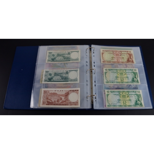 454 - British Commonwealth (90), a good group of Queen Elizabeth II portrait notes in an album, Bahamas (1... 